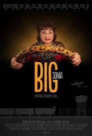 The movie poster for Big Sonia film, showing an older woman with dark hair, with her hands on a large leopard print covered steering wheel. 