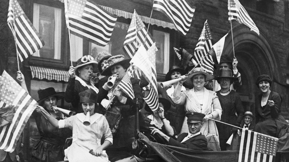 a photograph of women celebrating when they got the vote!