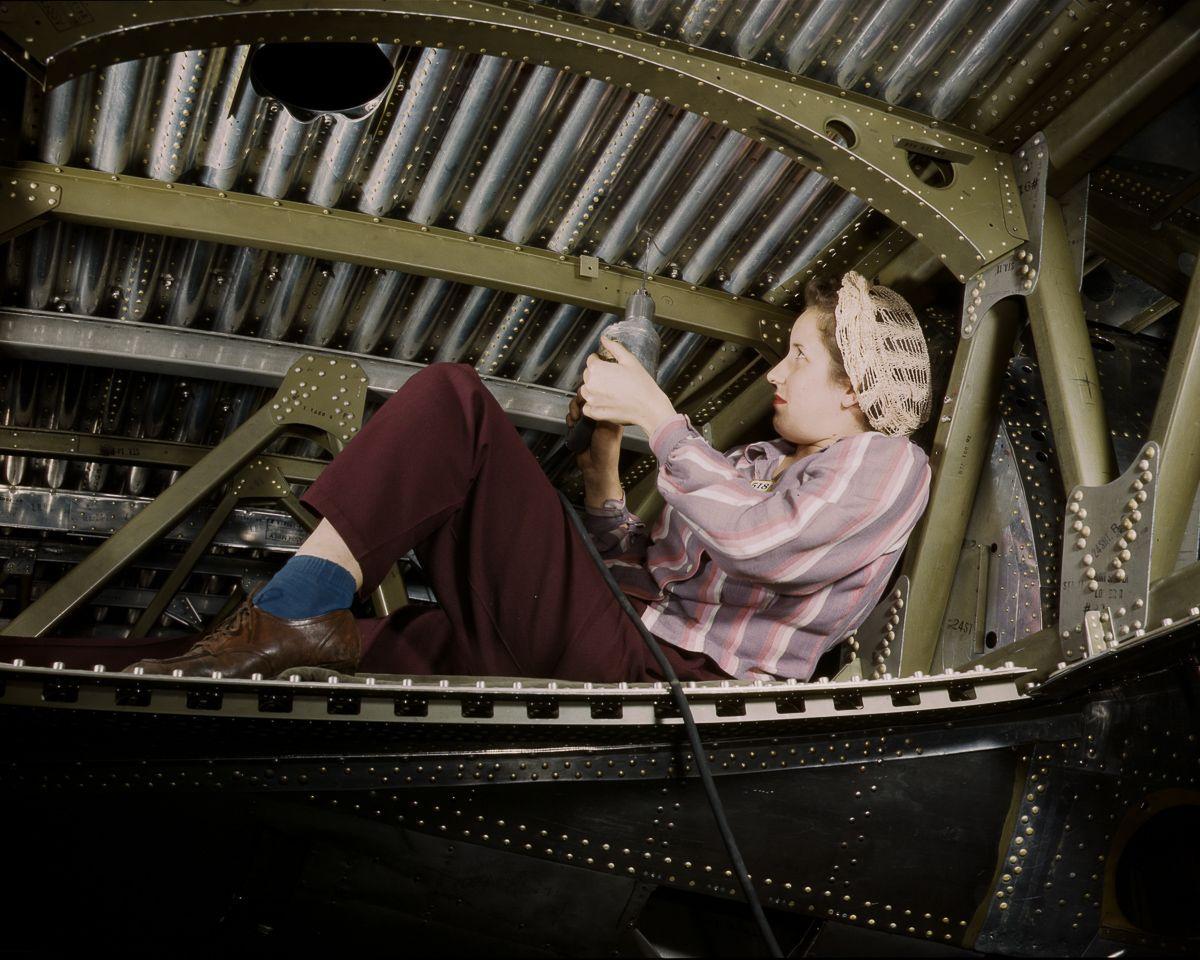 A woman works on a Douglas aircraft in 1942. 